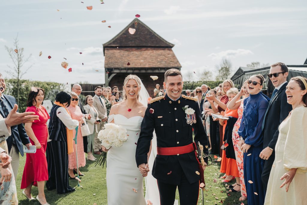 bride and groom walking through confetti
