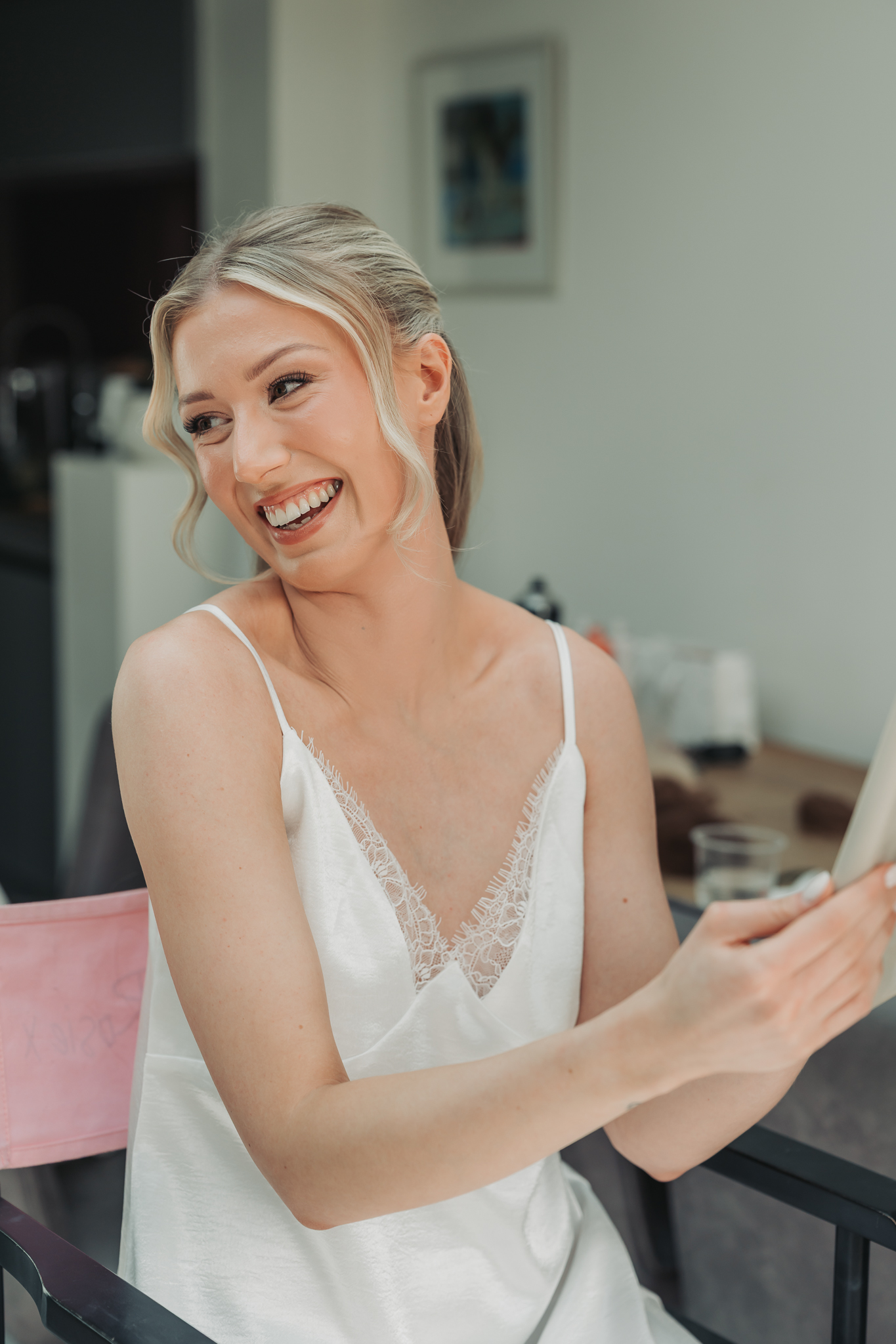 bride laughing and looking happy over her shoulder