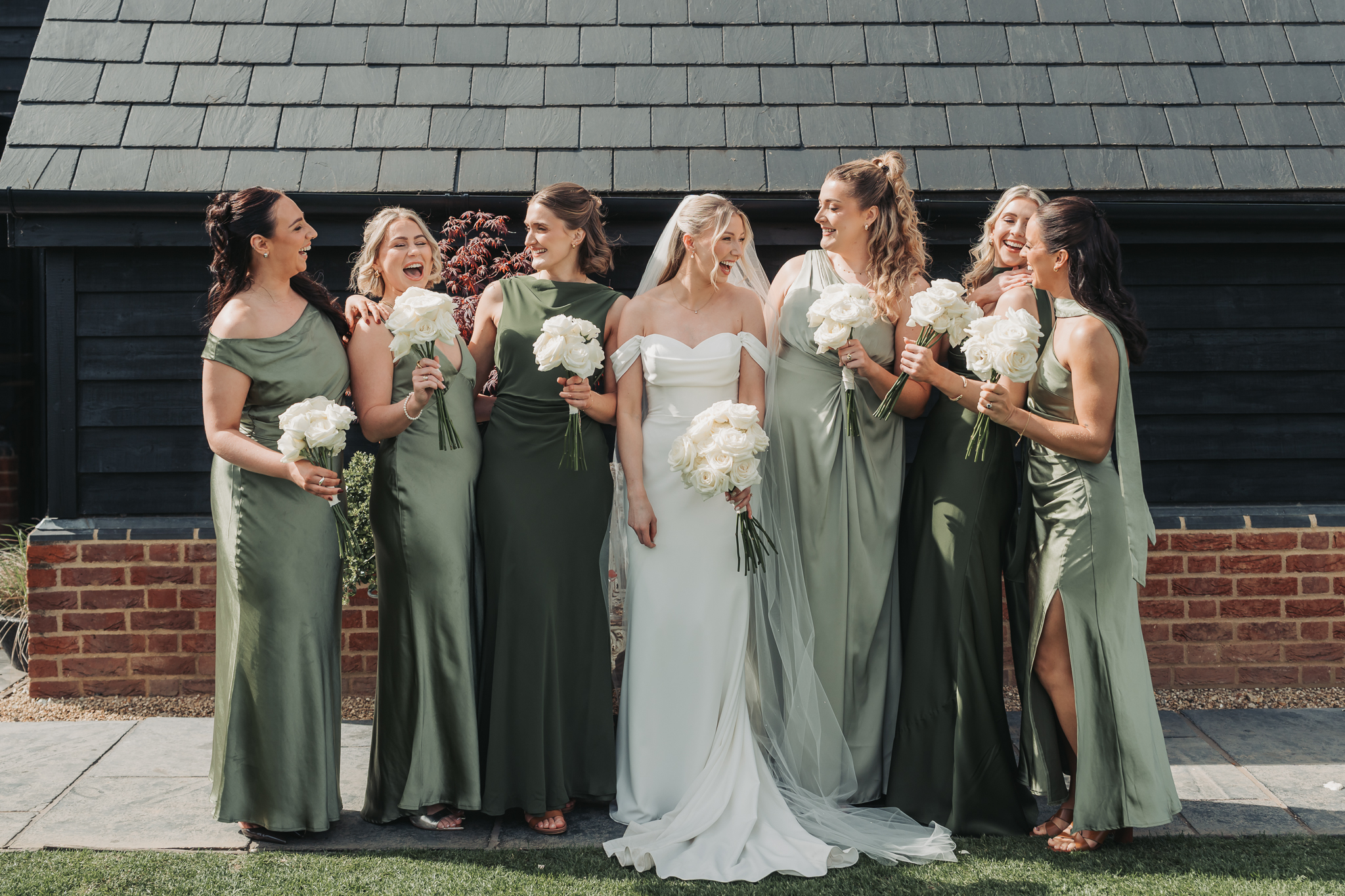 bride laughing with bridesmaids