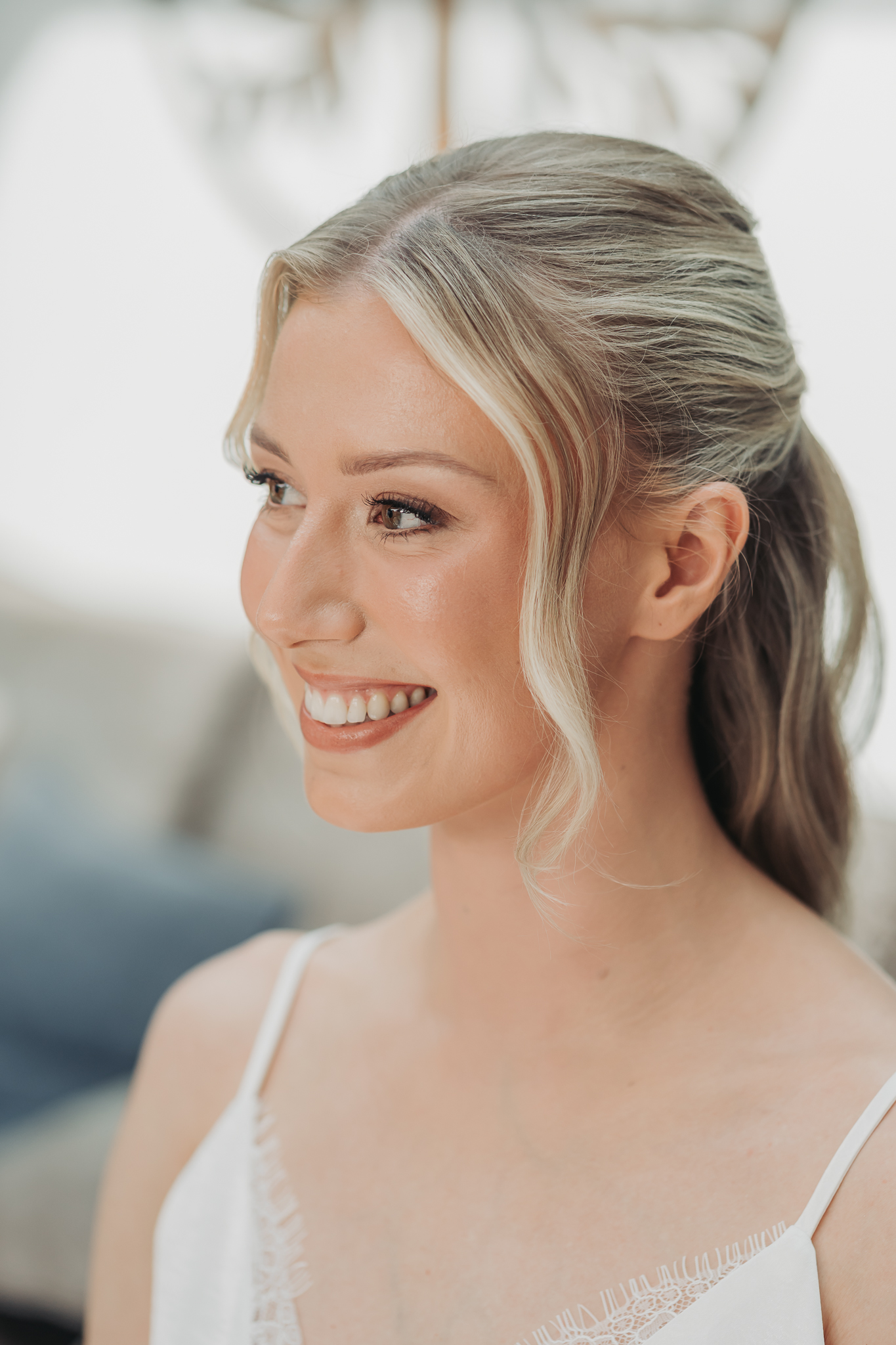Close up portrait of bride with blonde hair smiling