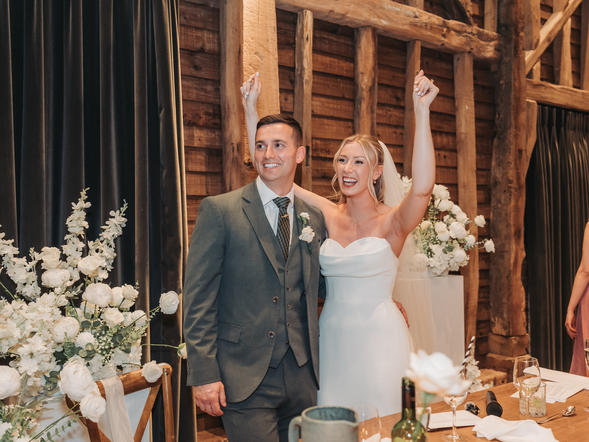 couple celebrating with arms in the air